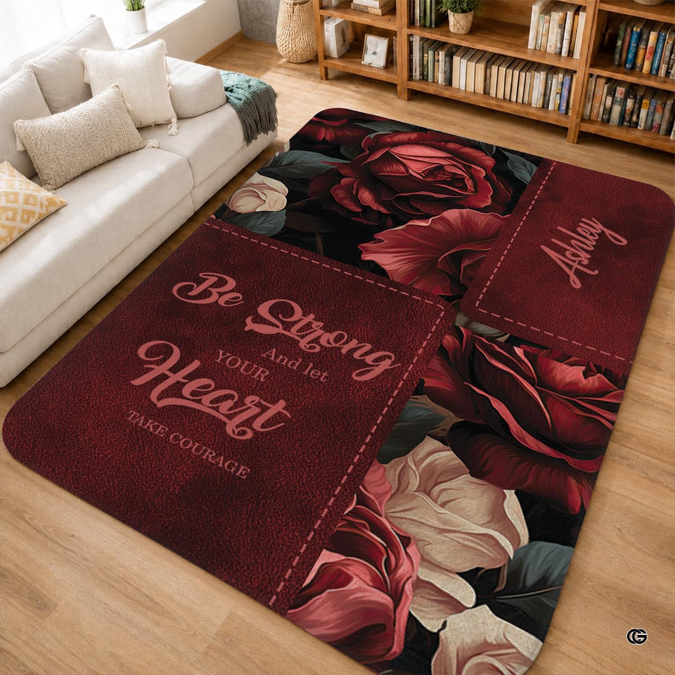 Moody red rose floral area rug placed on light wood flooring in a cozy living room