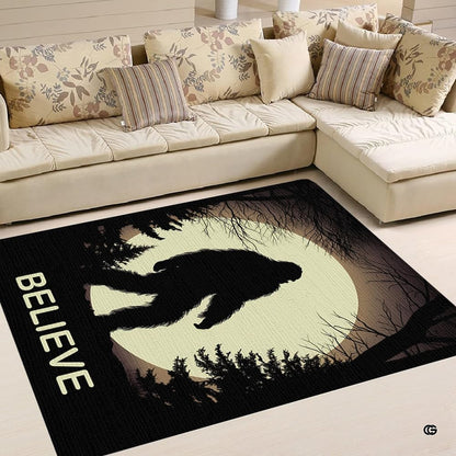 Overhead view showing Sasquatch forest artwork and moonlit accents across an area rug. - thumbnail image 2 of 5